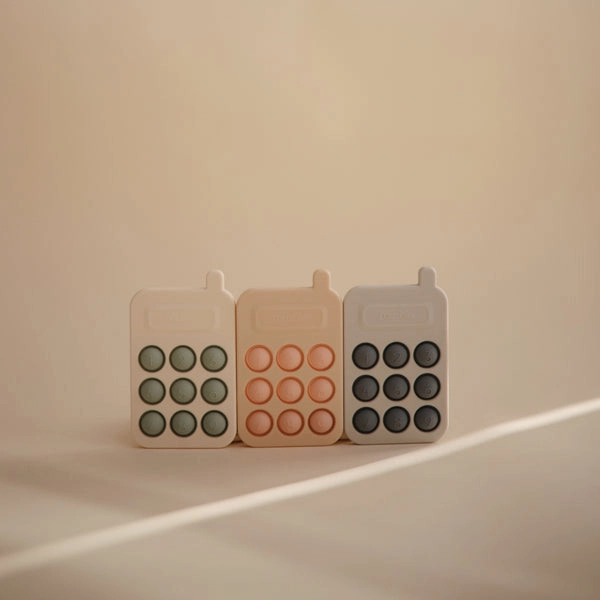 Mushie Phone Press Toy Blush